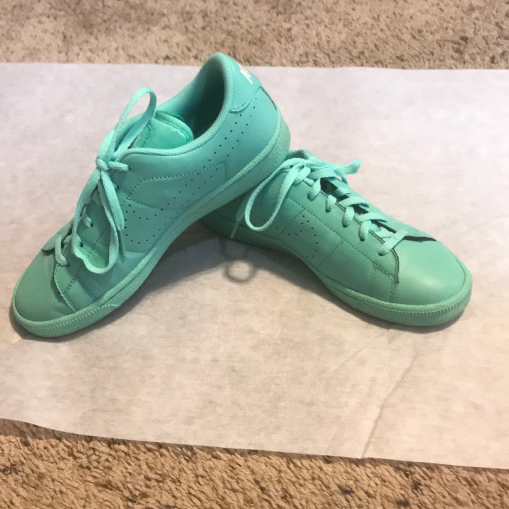 Mint green Nike tennis shoes